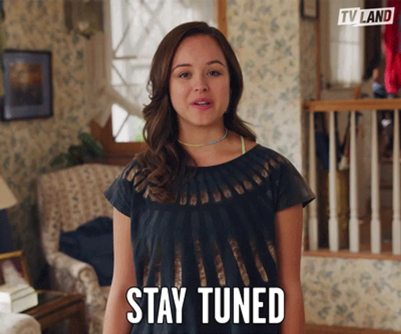 Lady saying 'stay tuned'