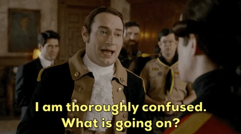 A man talking to another man saying 'I am thoroughly confused. What is going on?'